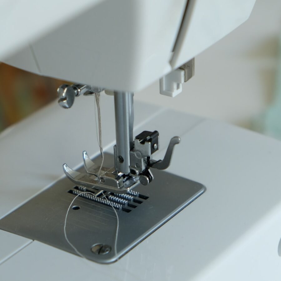 white sewing machine on table